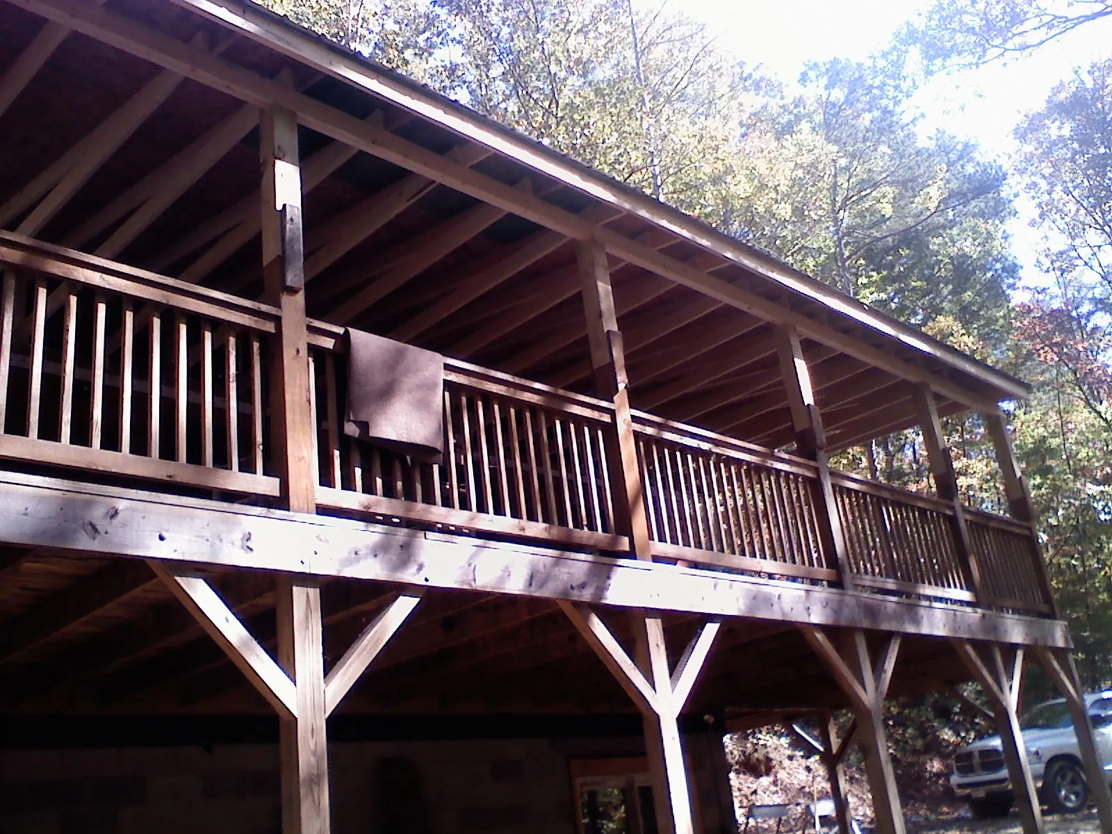 Timber framing under a new elevated porch and deck — Roof Leak Repair in Northfield by Roofing Brothers